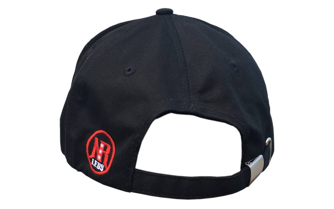 Back of black ball cap with NR button and adjustable strap