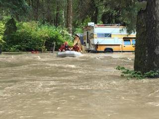 Swift water flood zodiac rescue campers